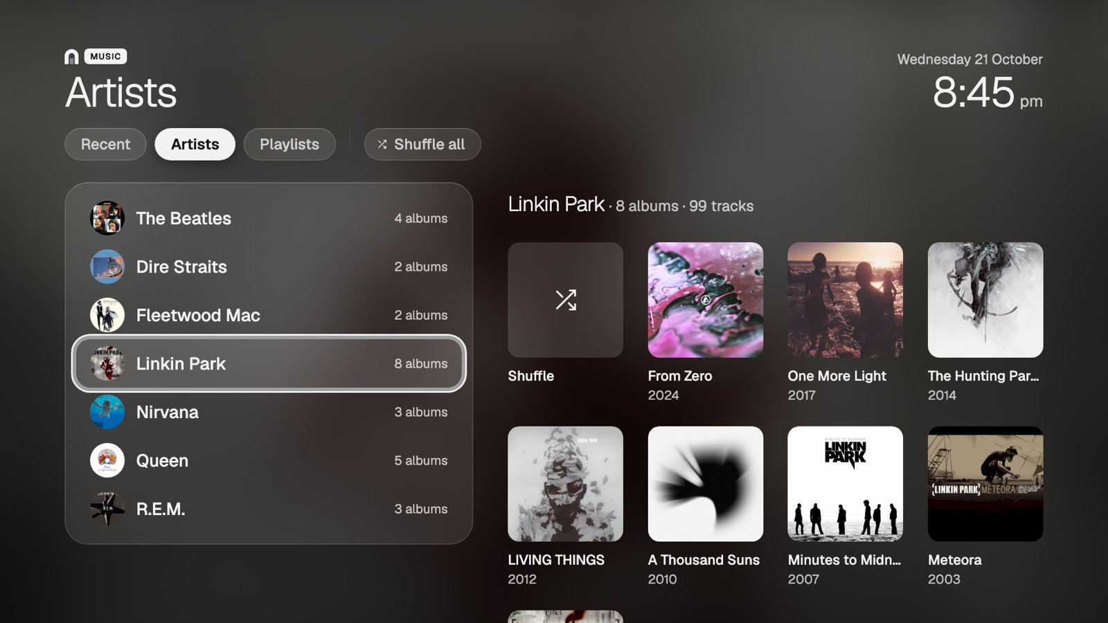 Artist list beside the focused artist’s albums and Shuffle tile